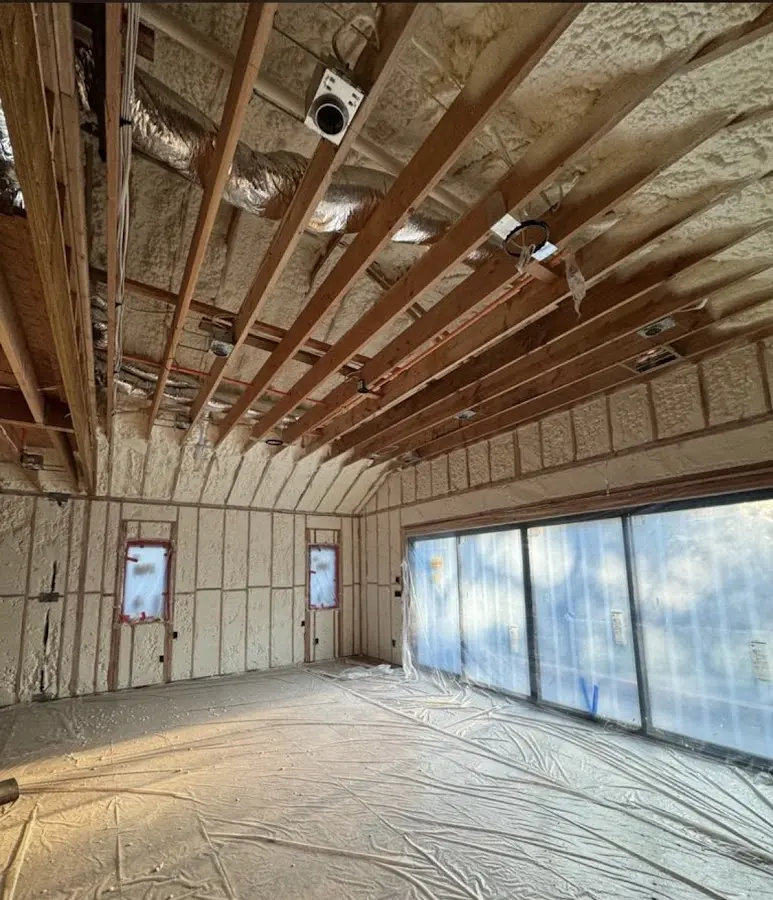Interior walls and ceiling insulated with spray foam during new construction in West Monroe